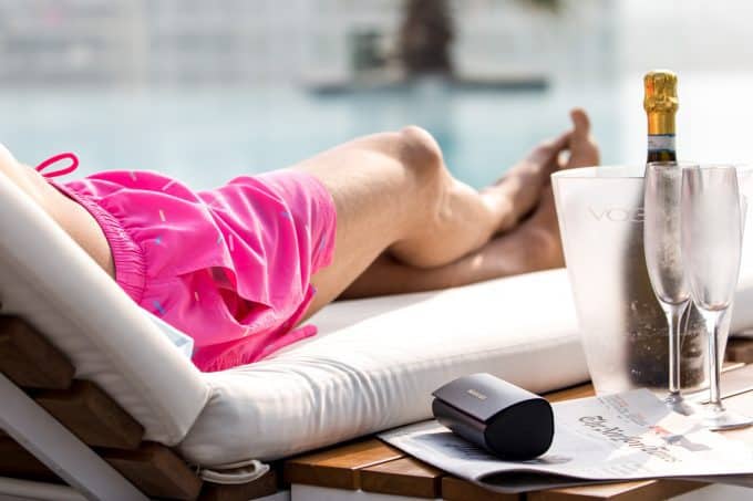 Sprinkles Pink Swim Shorts by the pool