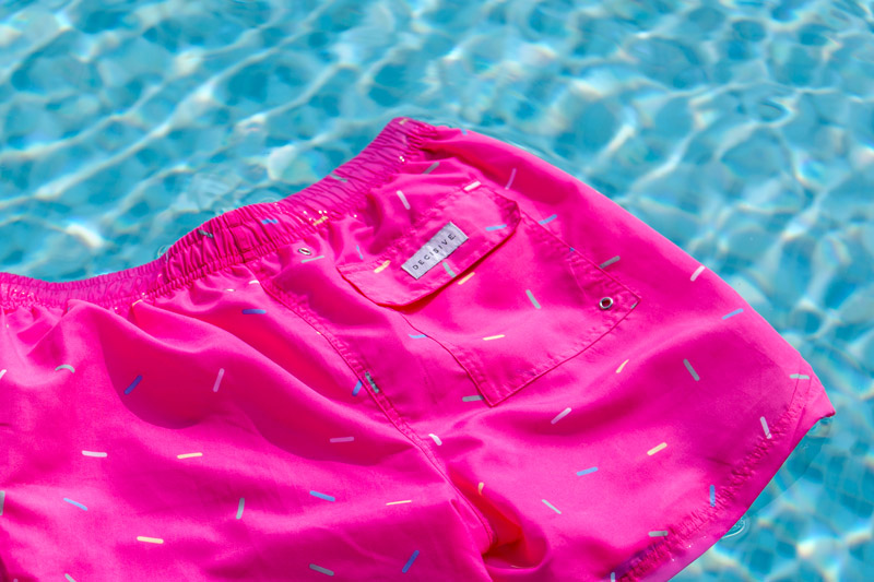 Sprinkles swim shorts in pool